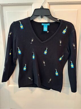Alexandra Bartlett Black V-Neck Sweater with Blue & Yellow Bottle Embroidery